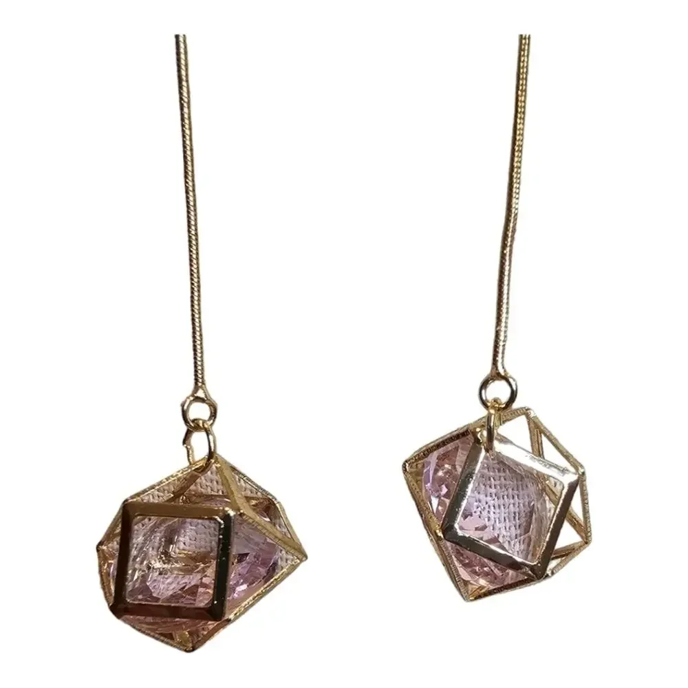 Guess Los Angeles  Gold Toned Long Geometric Cage w/ Floating Pink Crystal